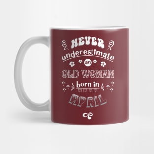 Never Underestimate an Old Woman Born in April Mug